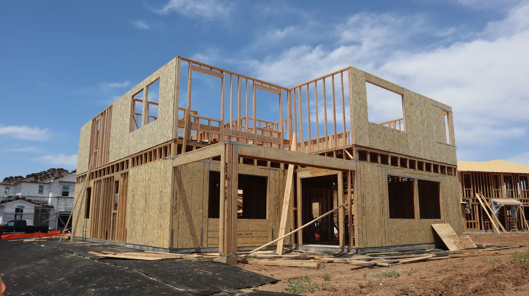 Timber-framed house under construction — illustrative stock photo